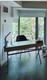 Glossy white desk with chrome legs